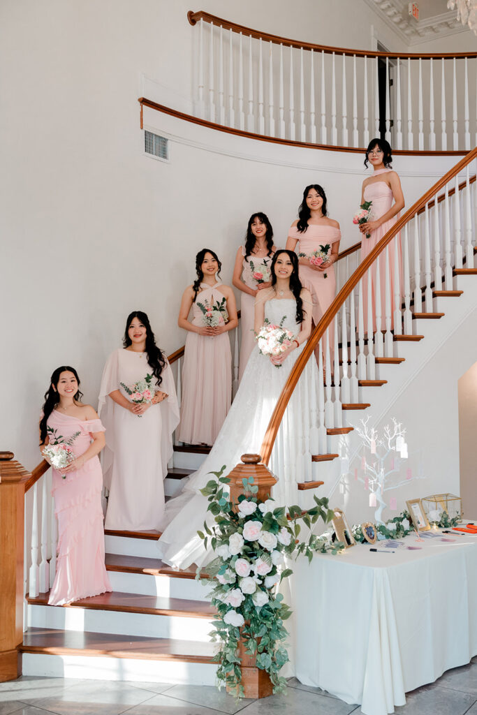Bridal party on the grand staircase at Luxmore Grande Estate